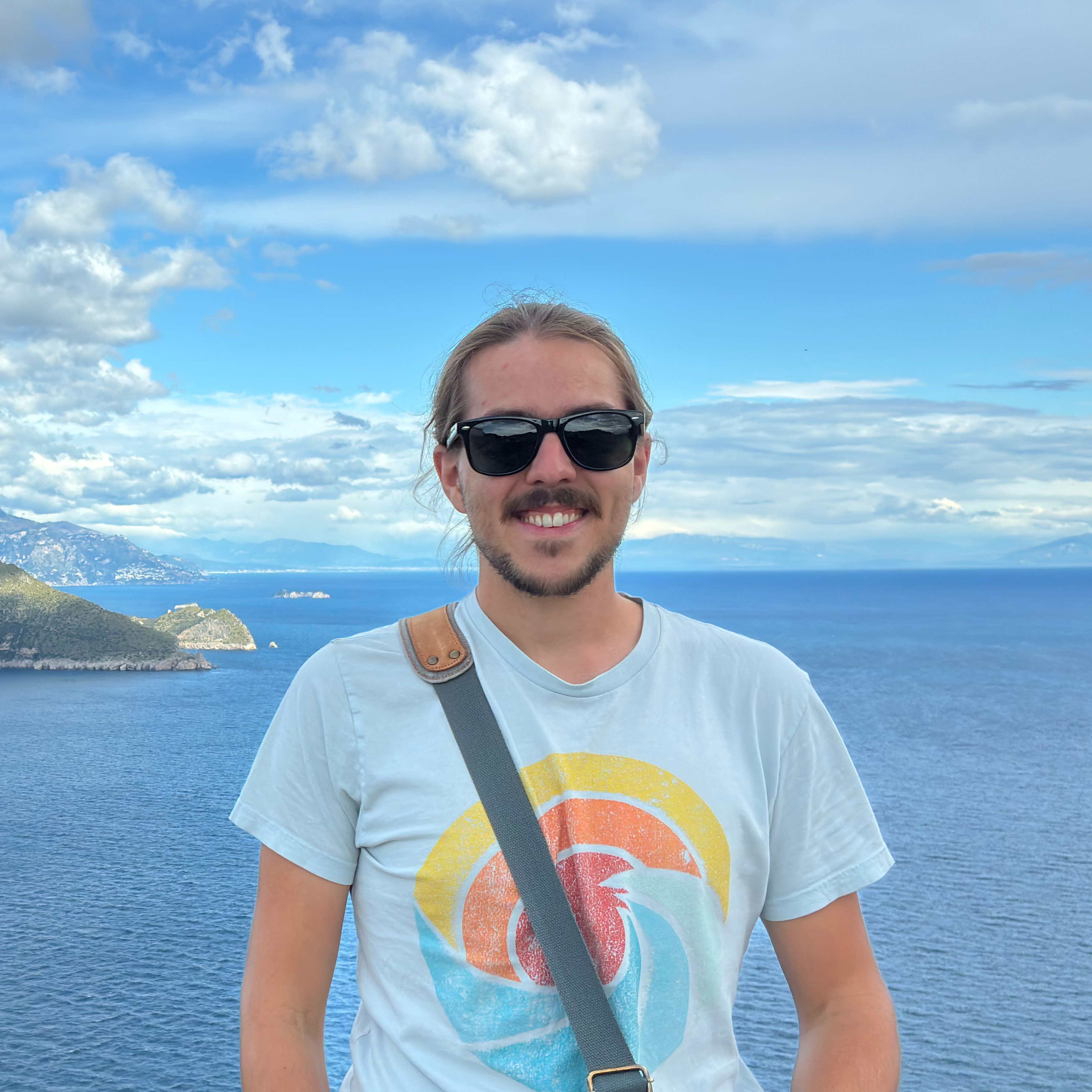 Picture of Casey Perdue in front of the Mediterranean sea at Capri.